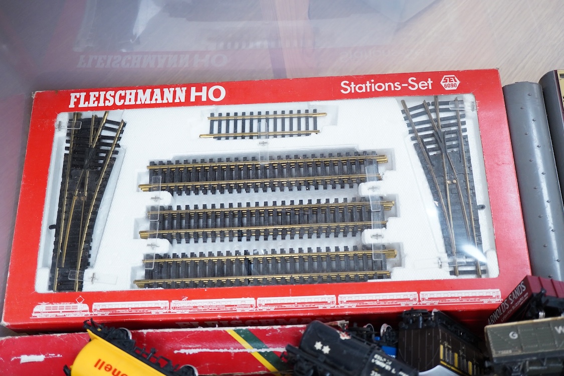 A quantity of HO and 00 gauge railway, comprising; twelve locomotives including a boxed Fleischmann 0-4-0 catenary electric locomotive, a Hornby Dublo Duchess of Atholl, etc. eleven bogie coaches, sixteen freight wagons,